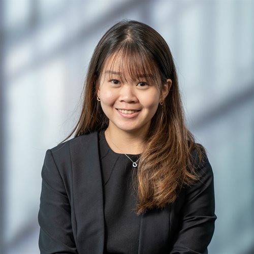  female colleague smiles at JPMorgan Chase technology event.