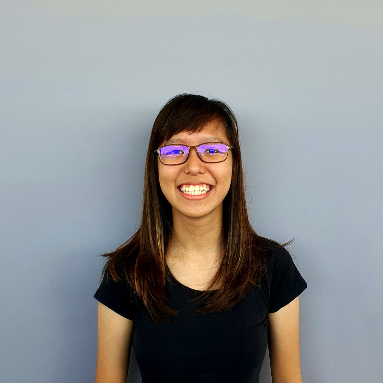  female colleague smiles at JPMorgan Chase technology event.